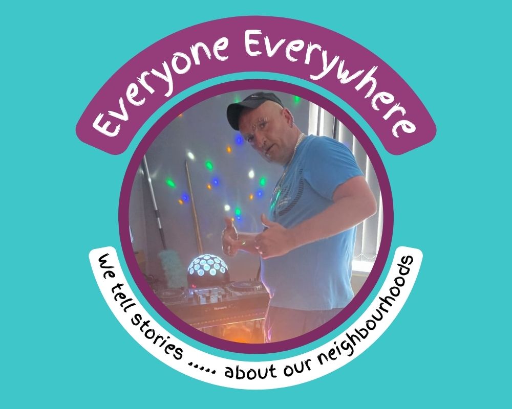 Man using DJ decks with flashing lights